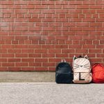 backpacks on the floor - image for article on teaching preschoolers responsibility