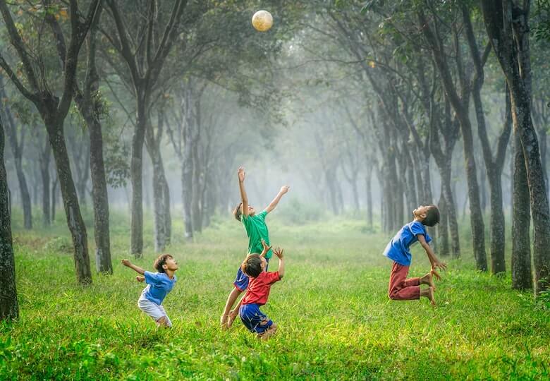 children playing ball jumping - preschool gravity learning concept