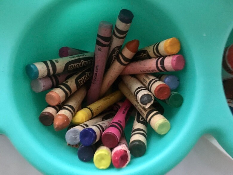 crayons in cup holder for teaching preschoolers fine motor skills