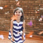 girl with confetti - benefits of dancing at daycare article image