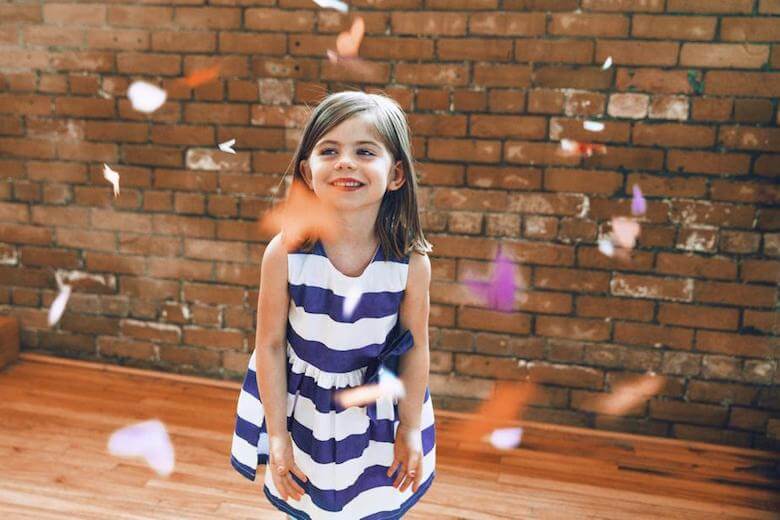 girl with confetti - benefits of dancing at daycare article image