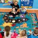 learning about space at daycare with early childhood educator