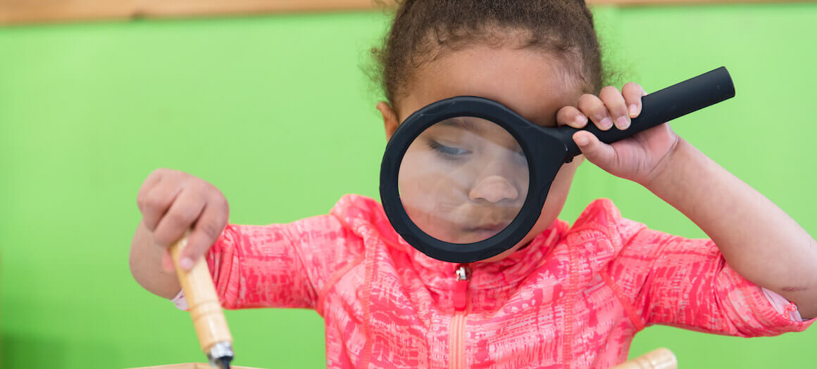 Slider 6: using magnifying glass at metro vancouver daycare centre