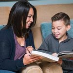 mother and son - learning to read at home, depicting teaching phonics