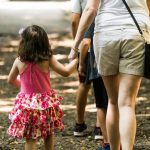 parent walking with child - image for article about when a child doesn't want to go to daycare