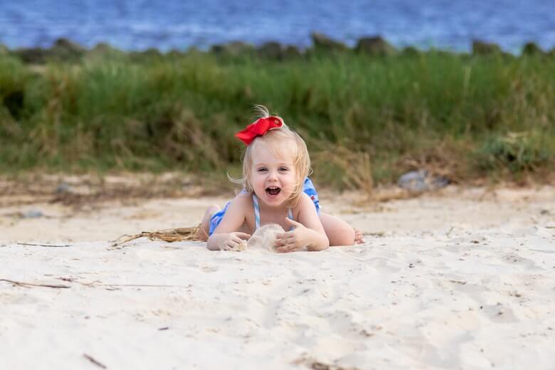 Preschooler Sand Game Playing In Sand At Beach 