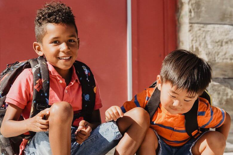 multi-racial children at school with backpacks - teach preschoolers about race and diversity article image