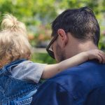 father carrying daughter - article image for tips to understand and solve temper tantrums in toddlers and young kids