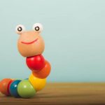wood toy caterpillar - image for article on strongstart bc vs preschool