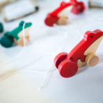 wood frog string pull toys - image for article on how professionals evaluate quality daycare programs